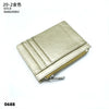 A gold-colored genuine leather zipper card holder and coin purse shown from above.