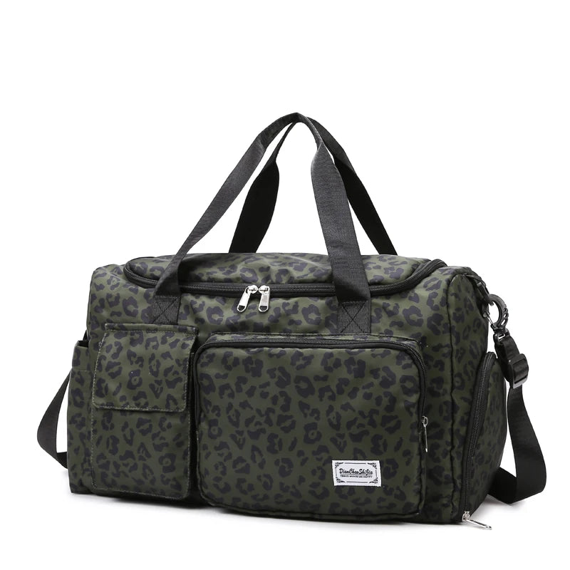 A dark green leopard print travel duffel bag with a separate shoe compartment.