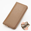 A tan genuine leather zipper wallet is shown open, displaying folded currency inside.