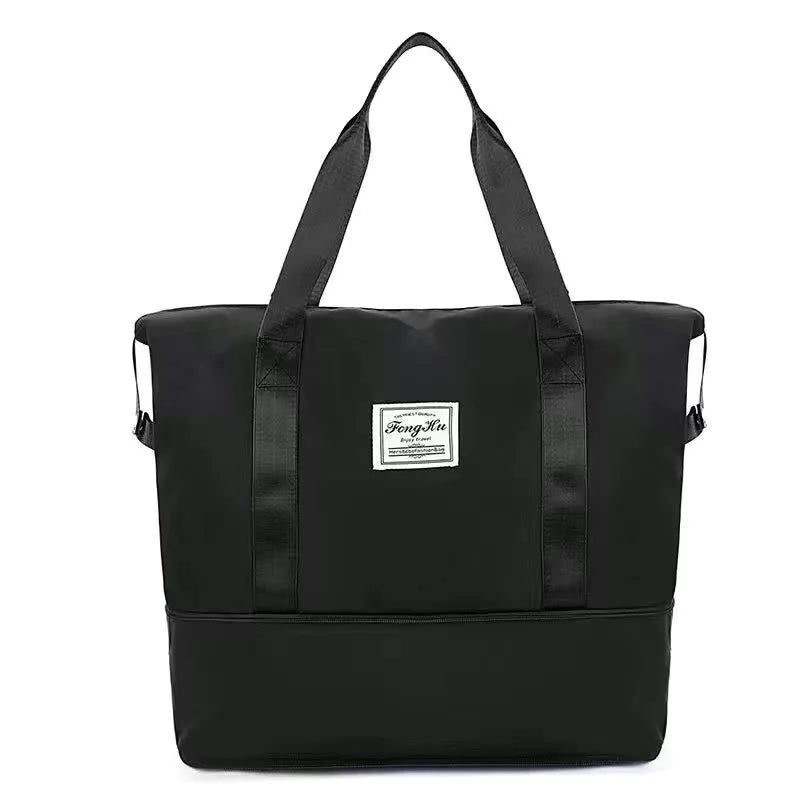 Black expandable travel organizer bag with black handles and waterproof material.
