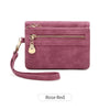 A mauve pink retro PU leather double fold wallet with a gold zipper and leather strap.