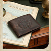 A brown leather wallet with a compass design rests on an old map and wooden surface.