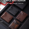 A collection of brown and black leather wallets and a pen displayed on a dark surface.