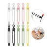 A set of silicone cable ties and cord organizers in various colors including white, gray, pink, and yellow.