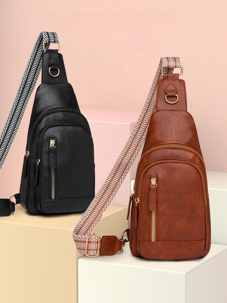 A brown PU leather crossbody sling bag with a patterned strap is displayed on a white surface.