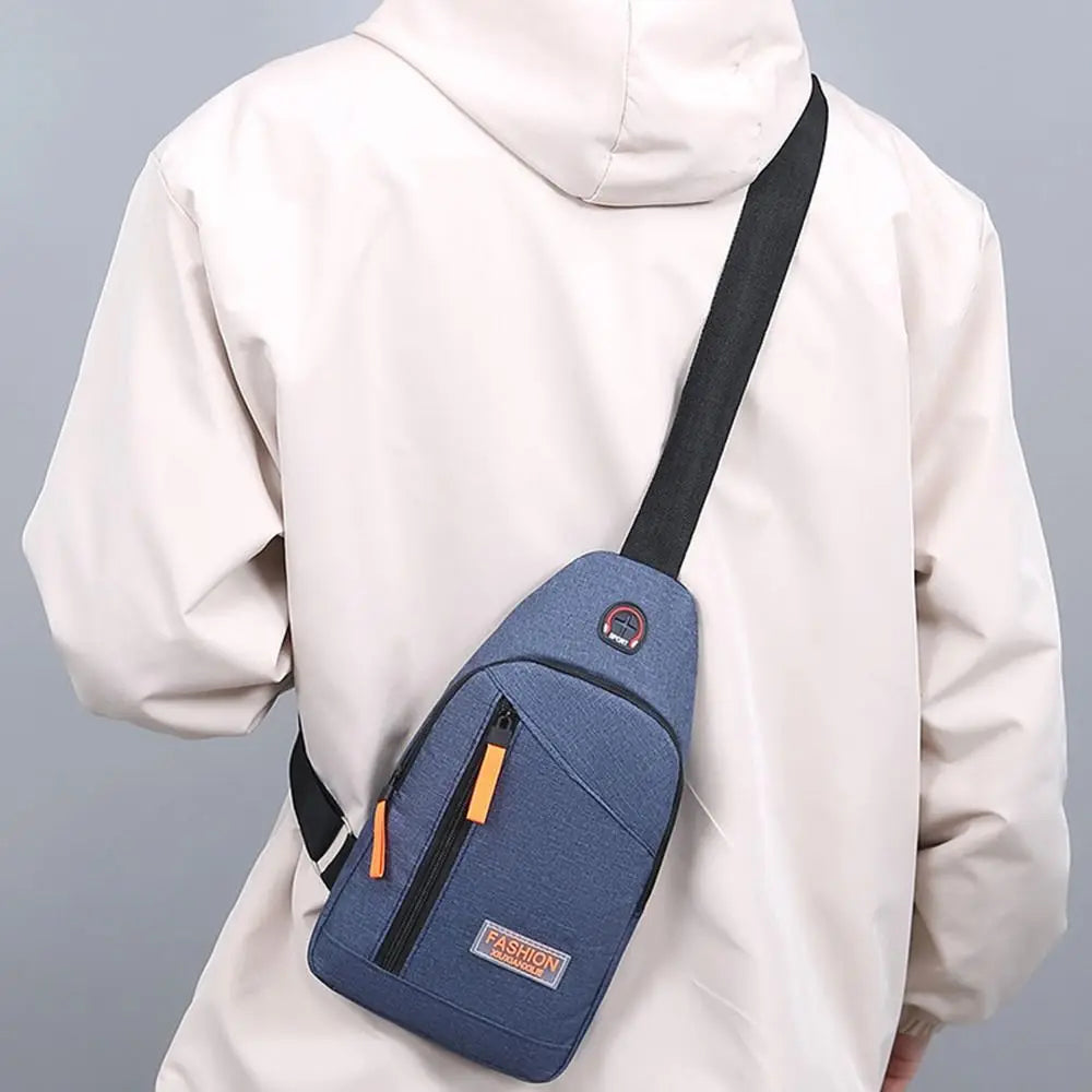 A beige hooded jacket is shown wearing a navy blue lightweight oxford cloth crossbody bag on the chest.
