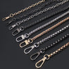 Multiple stainless steel diamond-cut curb chains of varying lengths and finishes displayed on a dark background.