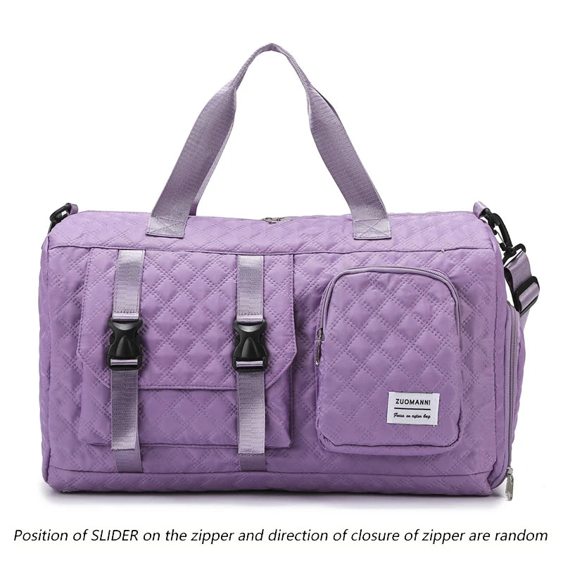 Purple nylon travel duffle bag with a quilted pattern and gray zipper pulls