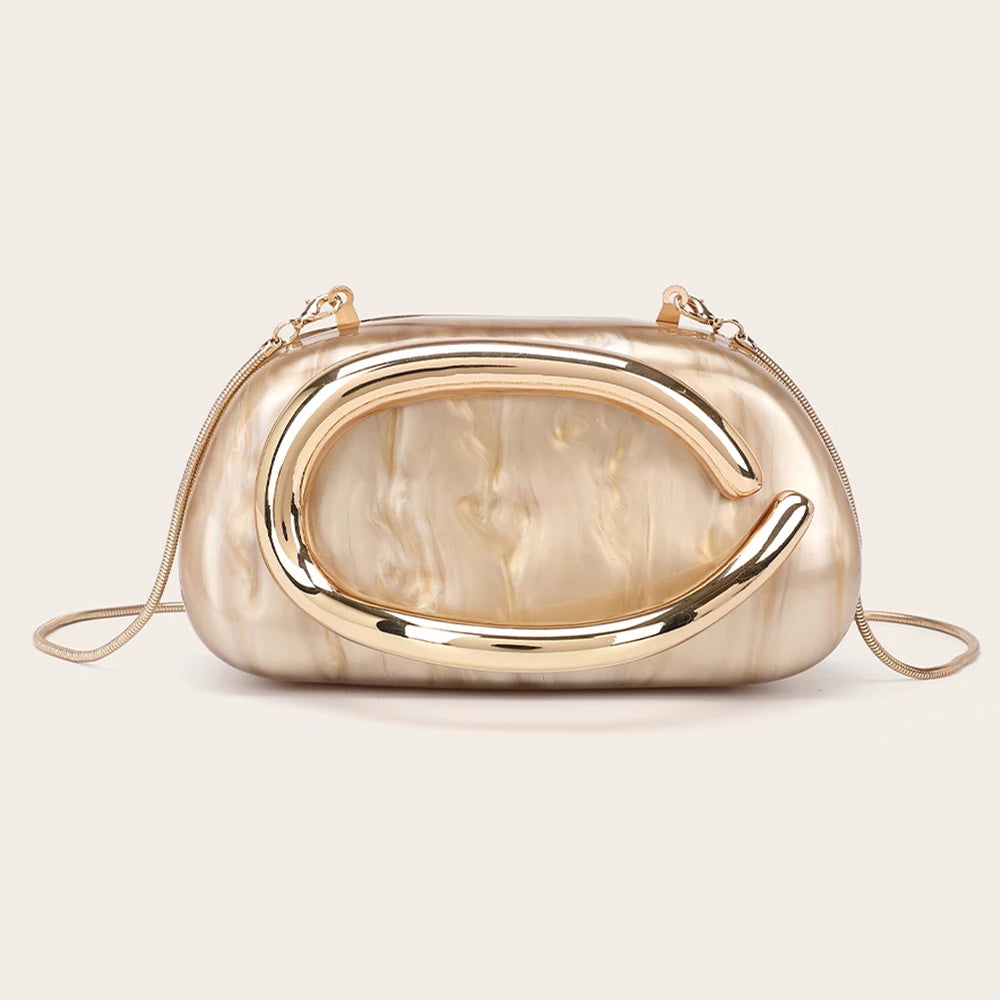 A gold-tone, marbled clutch bag with a curved, sculpted design.