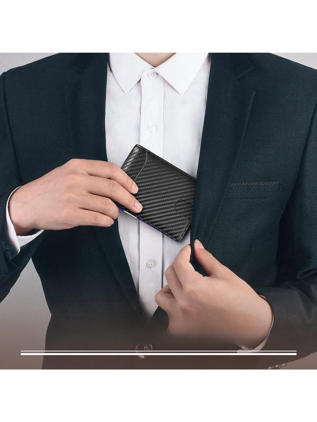 A hand is holding a black carbon fiber microfiber wallet inside a white dress shirt and dark suit jacket.