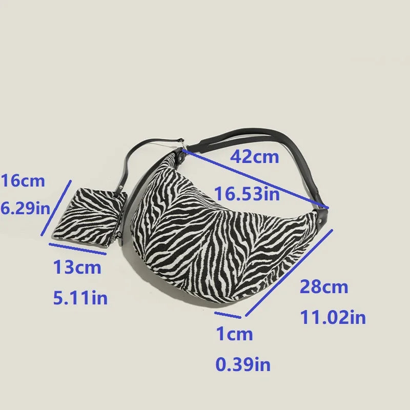 Schwarze Leinwand mit Zebra-Print, Schultertasche mit Riemen in verschiedenen Größen.