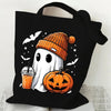 Black canvas tote bag featuring a white ghost and orange pumpkin print for Halloween