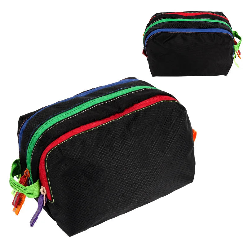 Black multi-compartment travel toiletry organizer bag with colorful striped accents