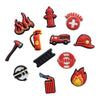 A collection of decorative shoe charms and pins including a firefighter helmet, a red cross badge, a red flame pin, and vario