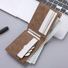 A brown PU leather wallet with a cartoon print is shown next to a laptop keyboard and some cash.