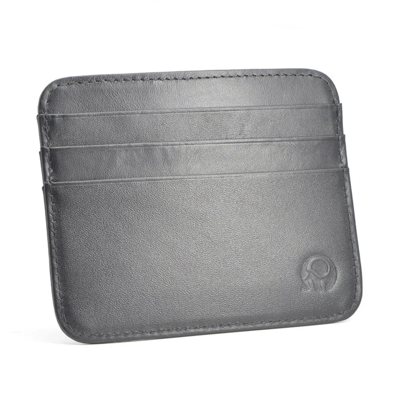 A gray genuine leather slim card holder wallet with stitched lines and a subtle embossed logo.