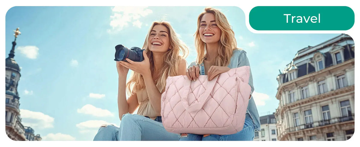 Two young women smiling while holding a pink quilted puffy tote bag outdoors with a cityscape in the background.