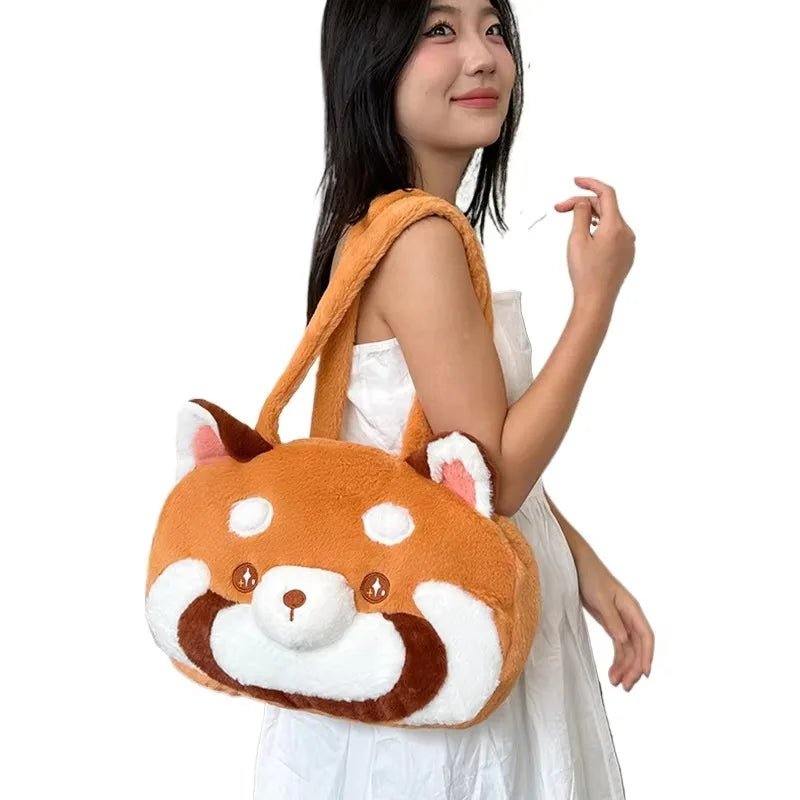 An orange and white red panda plush backpack with a cute face design.