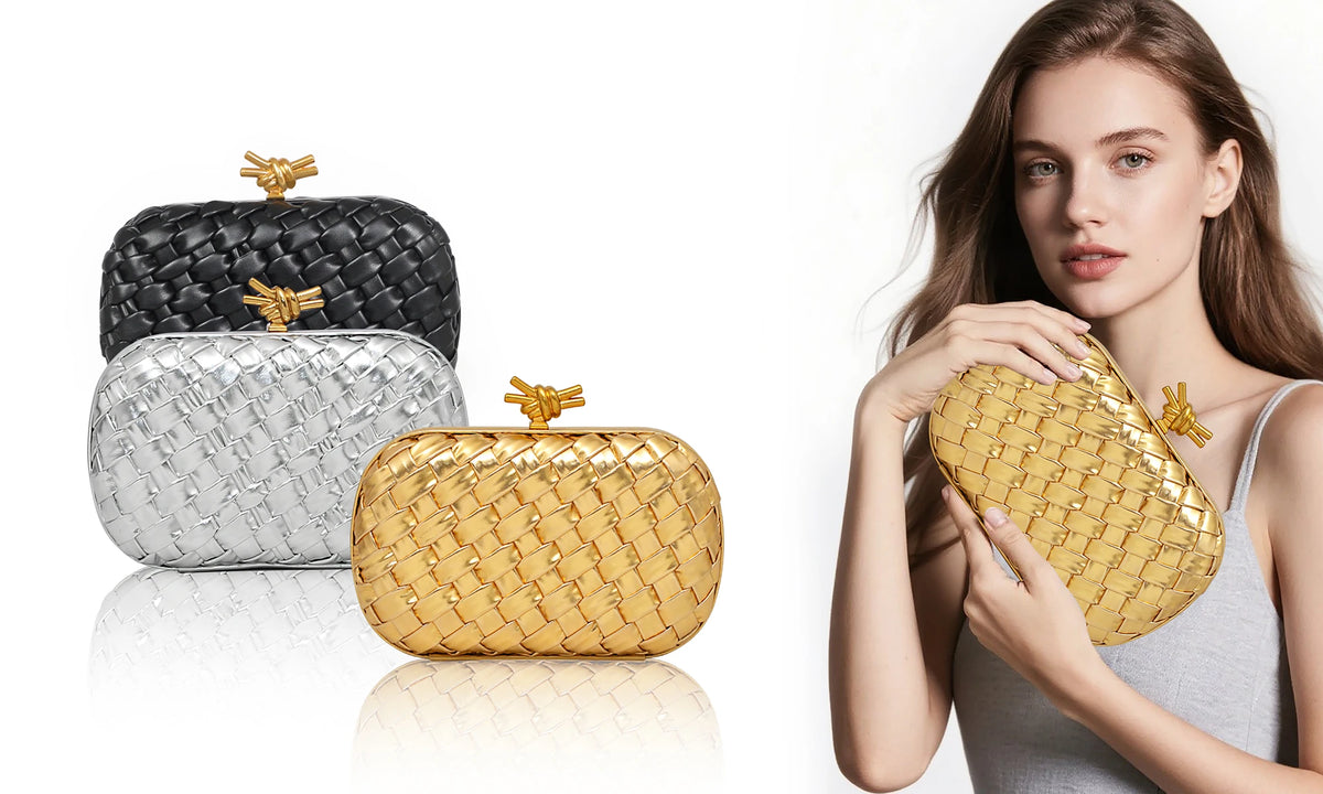 A woman holds a gold woven clutch bag next to silver and black versions.