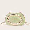 A light green, oval clutch bag with a gold-tone curved detail.