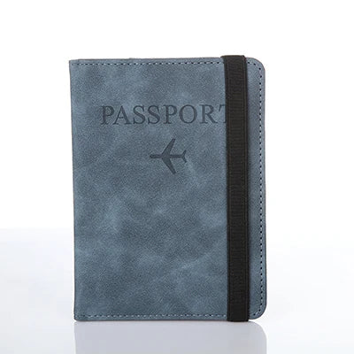 A dark blue leather passport organizer with a black strap and a silver airplane emblem.