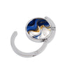Silver folding table bag hook with a round marble design featuring blue and gold swirling patterns