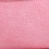 A close-up of a soft pink PU leather shoulder tote bag with fine grain texture.