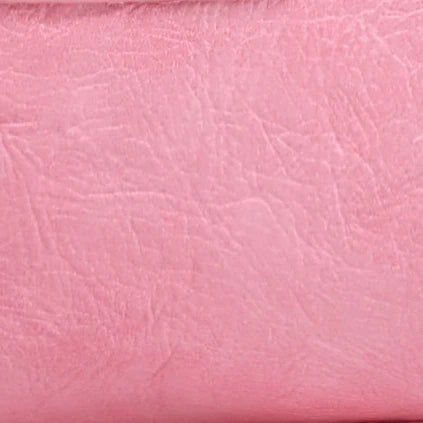 A close-up of a soft pink PU leather shoulder tote bag with fine grain texture.