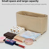 A beige felt bag organizer insert showing various cosmetic and small items like lipsticks and powders.