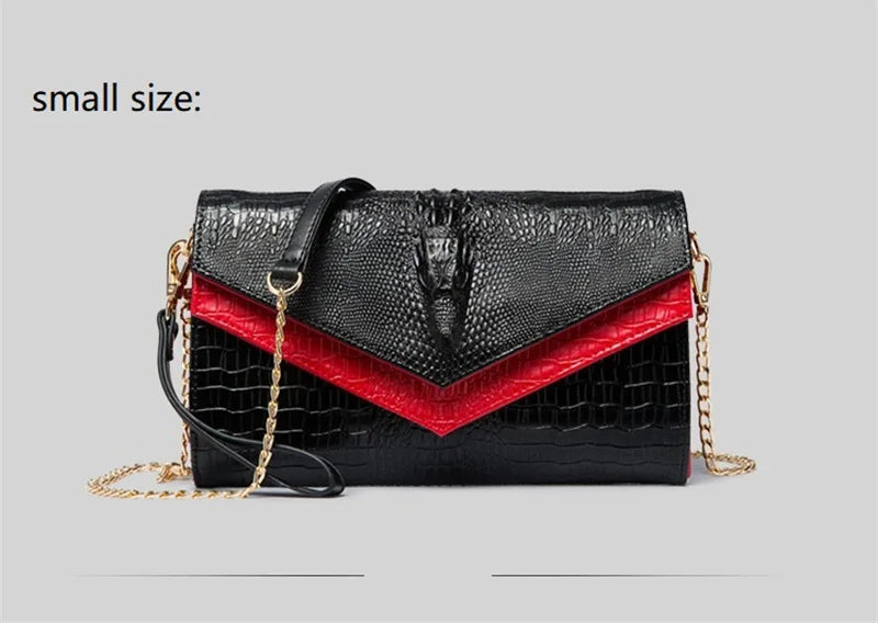 Black alligator pattern leather clutch bag with red accent and gold chain detail