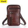 A brown genuine leather crossbody phone pouch belt bag with a zipper and adjustable strap.