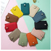 A collection of genuine leather slim card holders in various shades of green, yellow, pink, and brown arranged on a light bac