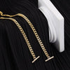 Gold chain strap for a handbag or crossbody bag displayed against a black fabric background.