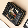 A black PU leather double-zip clutch wallet with a gold accent and a floral cartoon print.