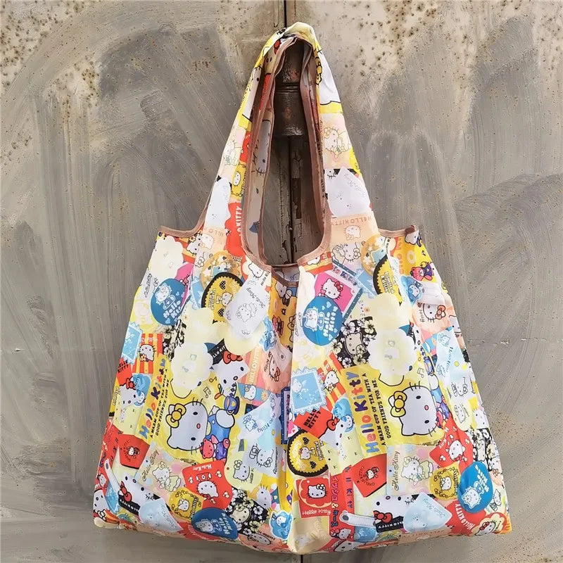 A light-colored reusable shopping bag with a patterned design featuring cute characters and colorful elements.