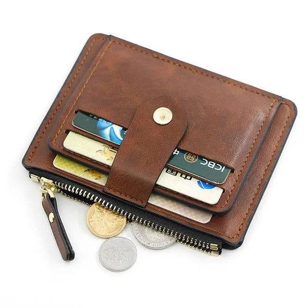 A brown leather card holder wallet with a zipper and a coin pocket displaying several cards.