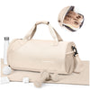 A beige waterproof travel duffel bag with a shoe compartment and accessories shown next to a pair of shoes.