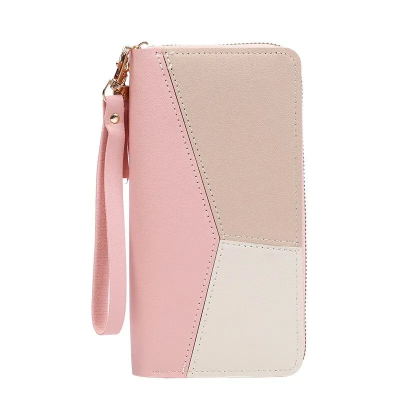 A light pink and cream colored fashion zipper wallet with a stitched design.