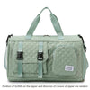 A light green nylon travel duffle bag with a quilted pattern and fabric handles.