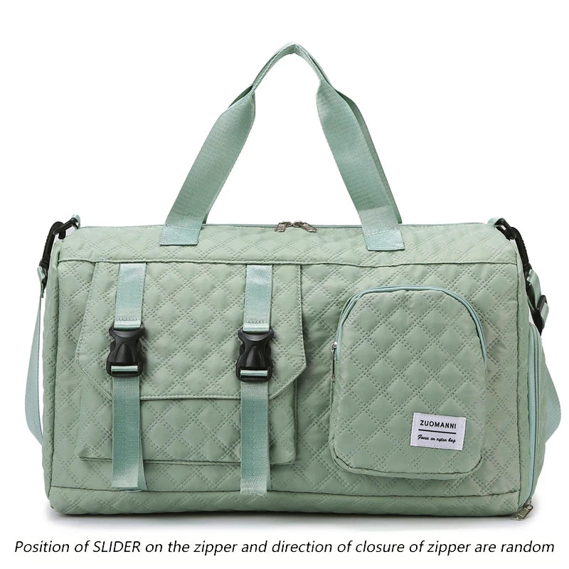 A light green nylon travel duffle bag with a quilted pattern and fabric handles.