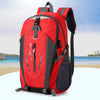 A red and black waterproof hiking backpack is shown against a light blue sea background.
