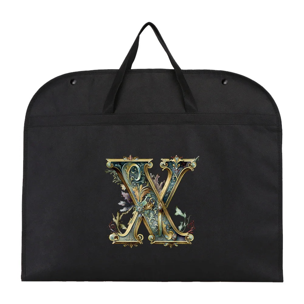 Black fabric dust cover and storage bag with a gold ornate letter X embroidered on it