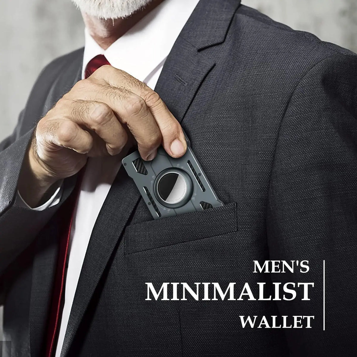 A close-up of a man's hand placing a slim metal card holder into the breast pocket of a dark suit jacket.