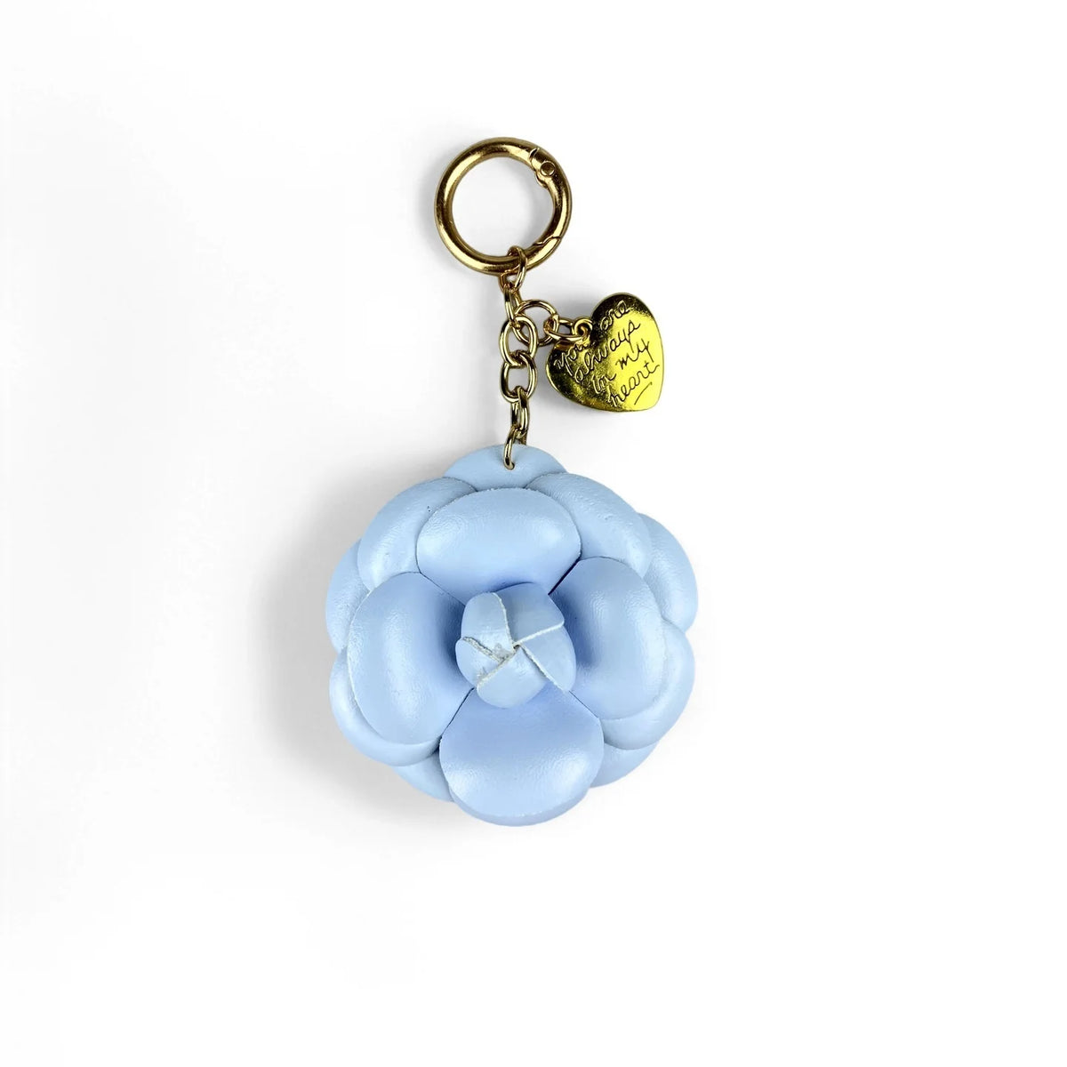 A gold-toned keychain featuring a light blue floral PU leather charm shaped like a flower bud.