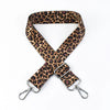 A leopard print adjustable crossbody strap for bags with silver hardware.