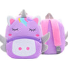 A purple unicorn plush backpack with pink accents and a rainbow horn.