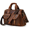 A brown genuine cowhide leather briefcase with leather straps and pockets.