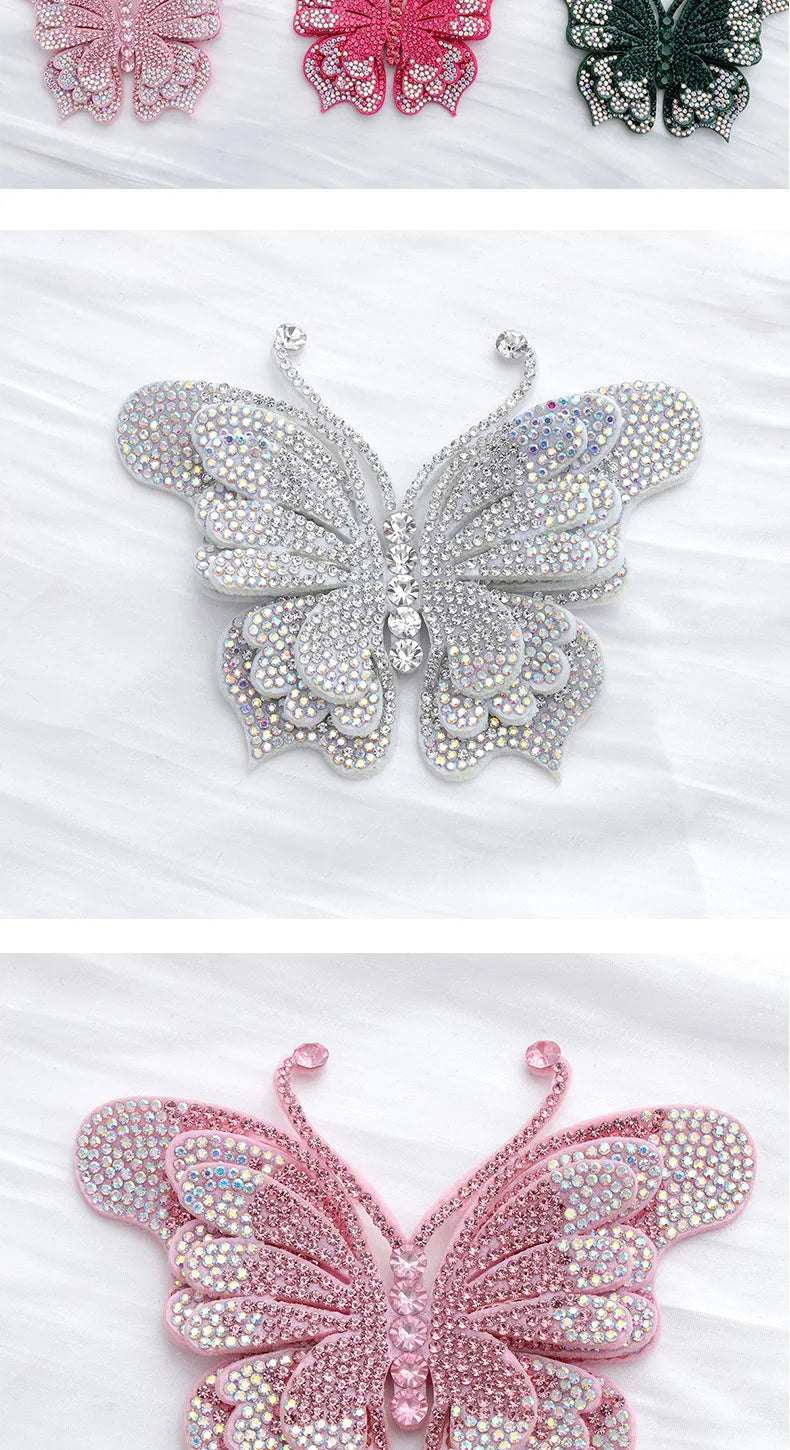 A close-up of a pink glitter rhinestone butterfly applique sticker with intricate detailing.