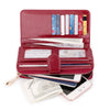 A maroon wax leather long wallet with a wrist strap is shown open, displaying various cards and holding a smartphone.