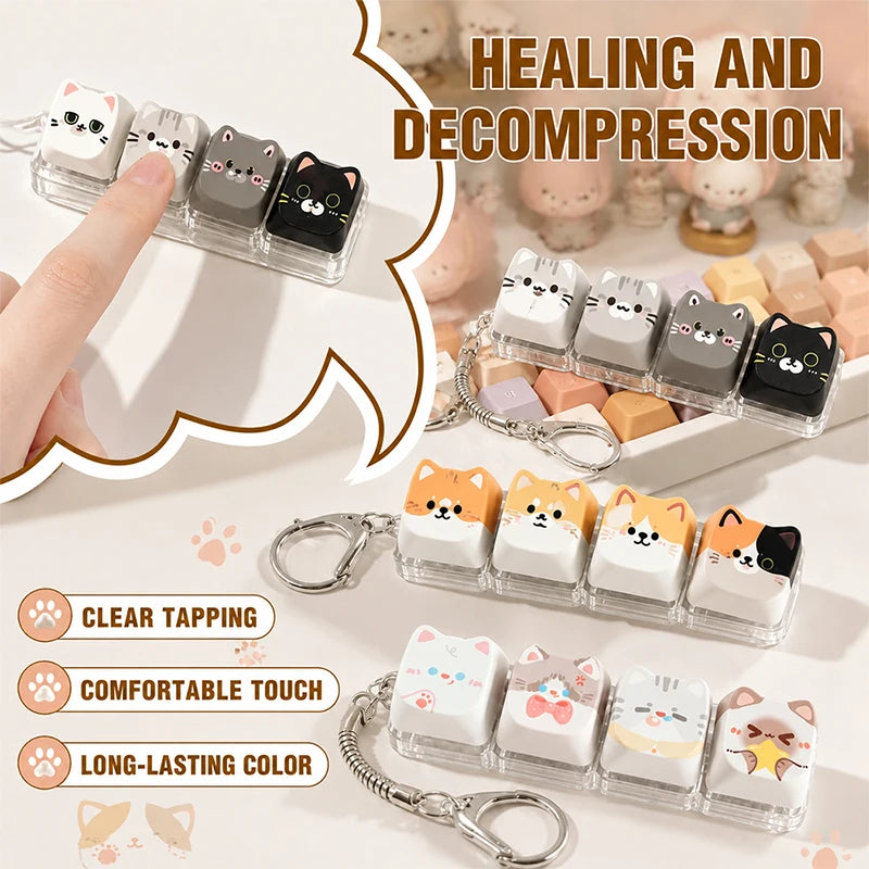 Clear acrylic keycap fidget toys shaped like cats with various colors and designs, shown on a white background.